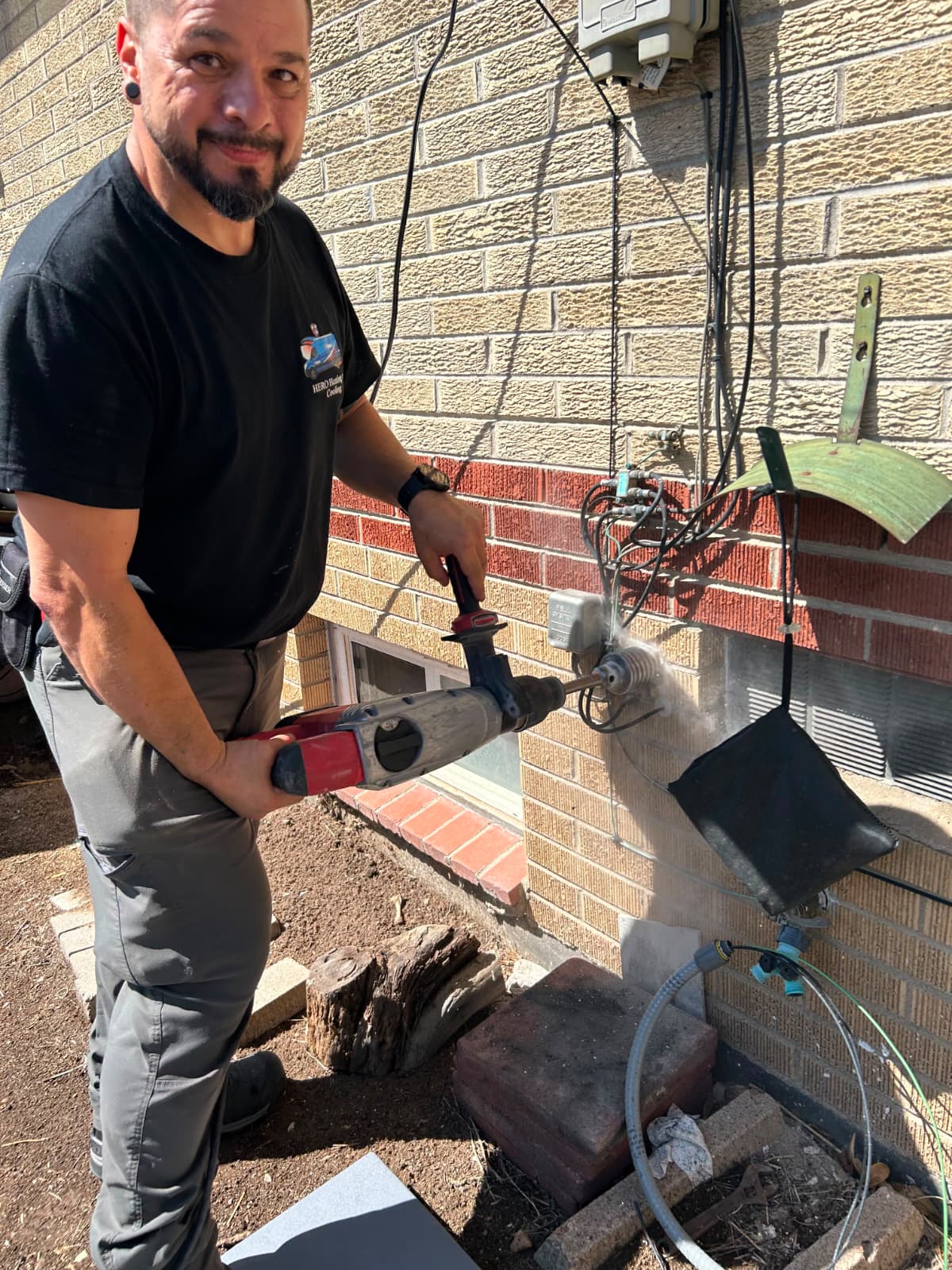 Hero Heating & Cooling technician doing electrical work