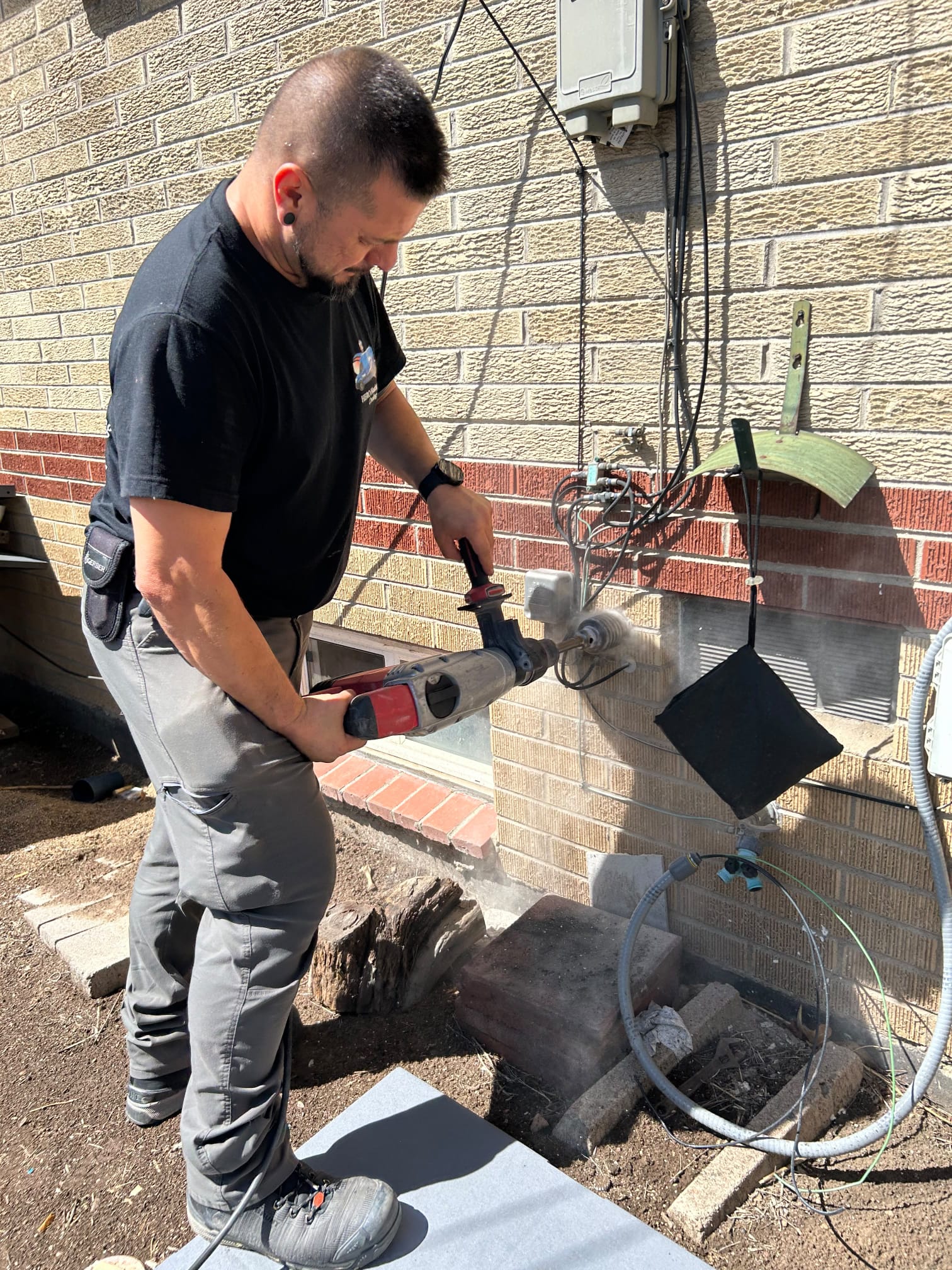 Hero Heating & Cooling technician doing electrical work