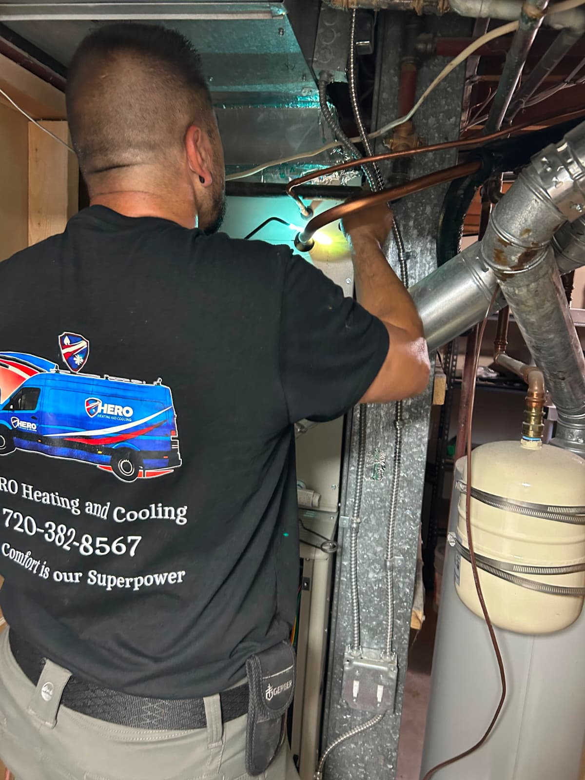 Hero Heating & Cooling technician soldering copper pipe
