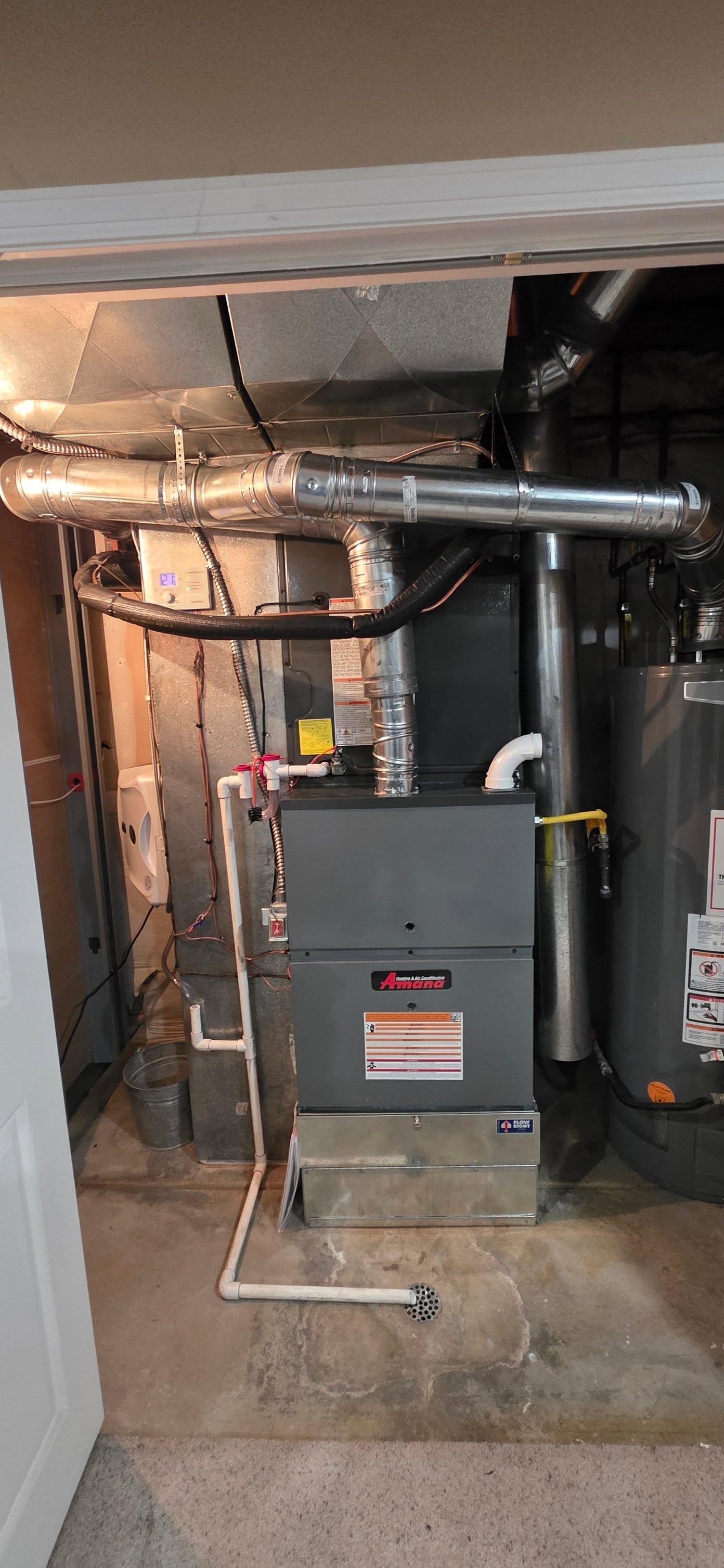 Amana furnace installed in a utility closet